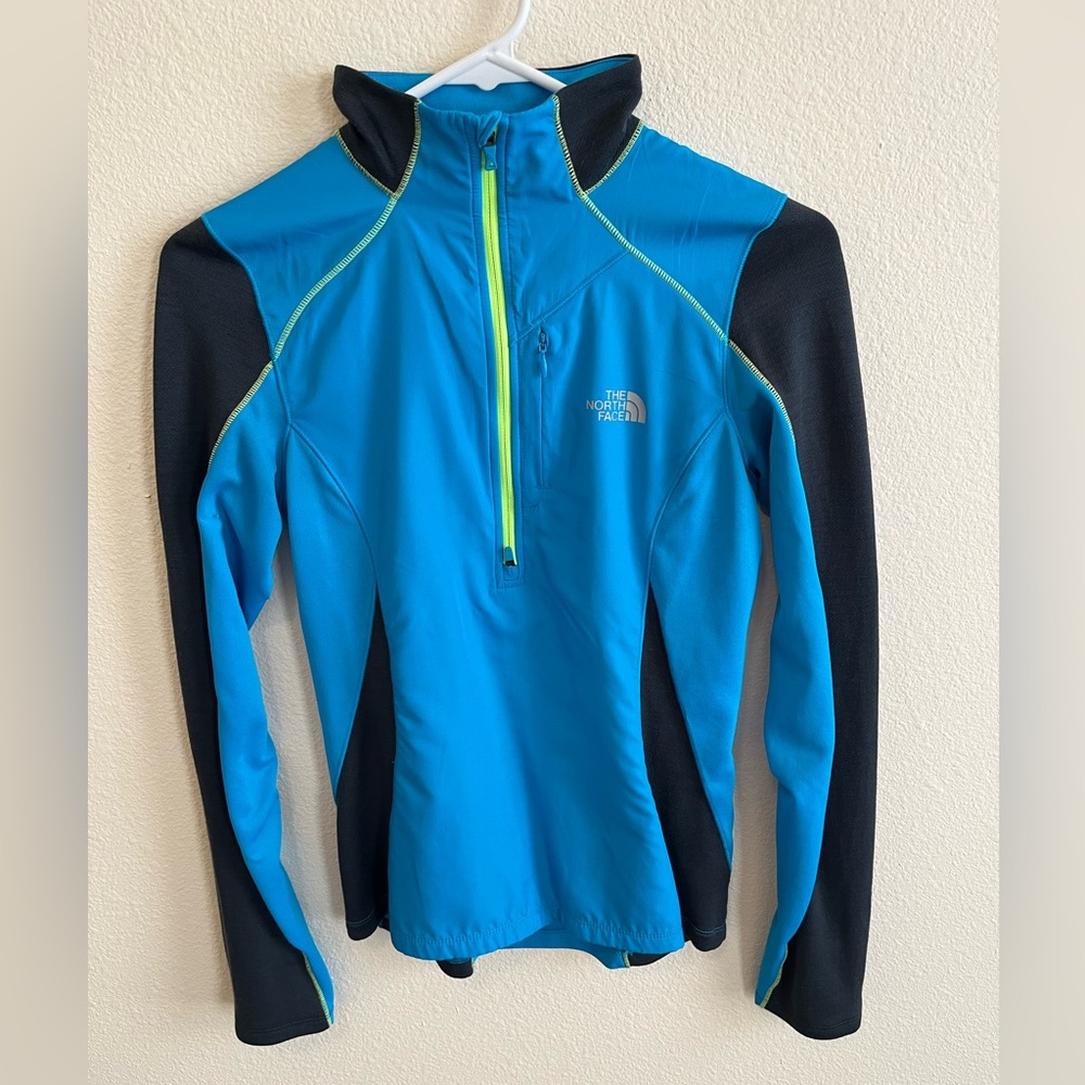 The North Face women’s blue long sleeve top, quarter zip, merino wool, size XS.